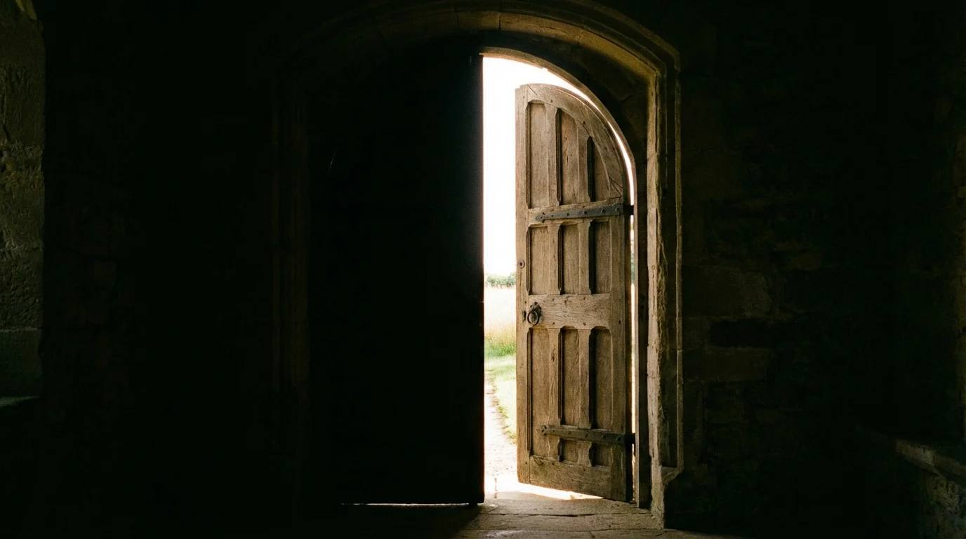 A slightly open wooden door leading toward a bright, safe path, symbolizing establishing safety.